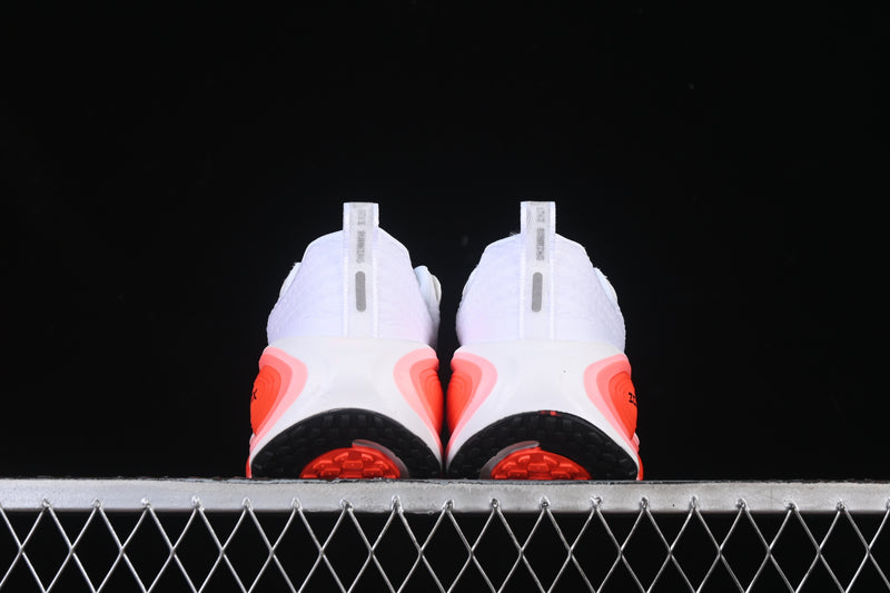 Nike Vomero Plus “White / Black / Bright Crimson”