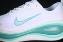 Nike Vomero Plus “White / Bleached Turquoise”